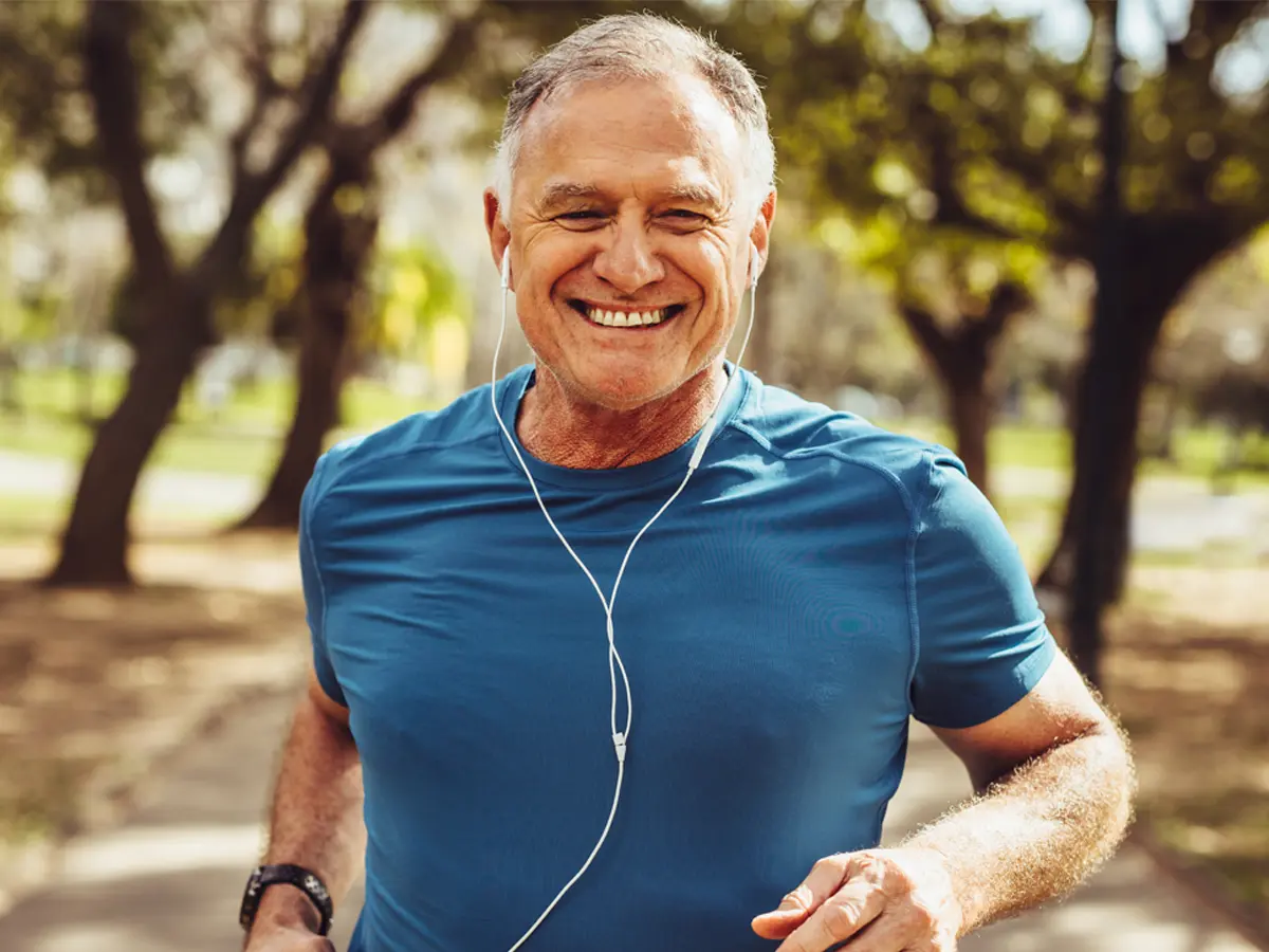 Man running with earbuds in